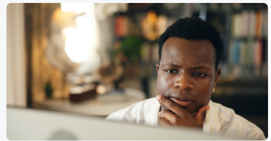 Person carefully researching financial claims online